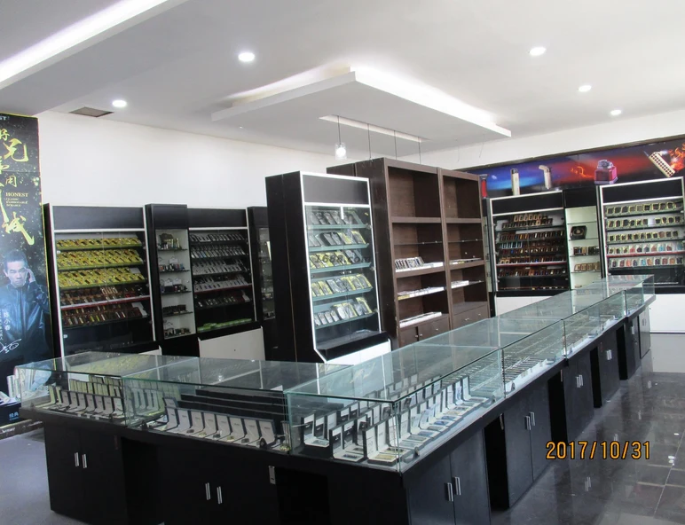 Lighter collections presented in display cabinets and glass counters. Company archive, 2017.