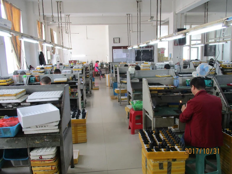 Assembly workstations and lighter components on the workshop floor. Company archive, 2017.